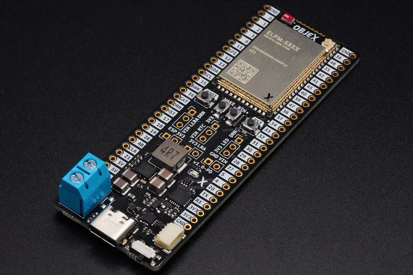 OBJEX Link development board with an ELPM module, USB-C connector and screw terminal, on a black surface